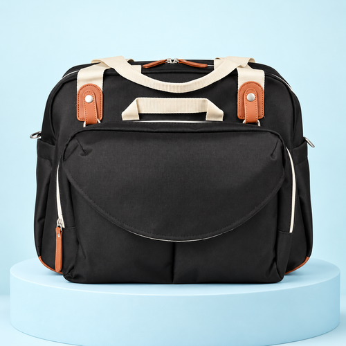 Sac à langer noir avec poignées crème et détails bruns